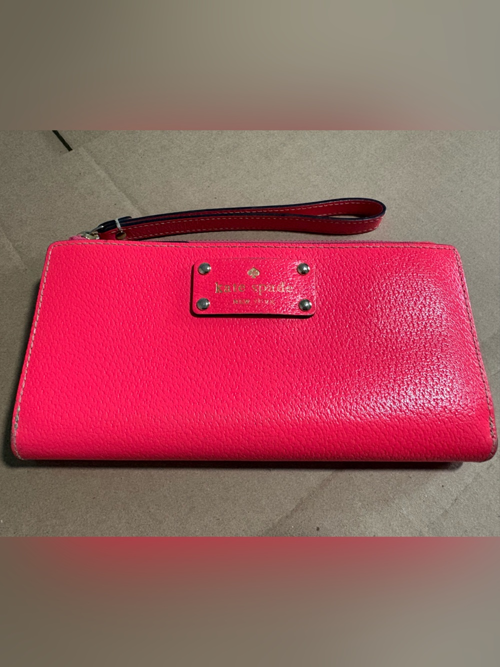 kate spade hot pink leather wristlet wallet with gold logo